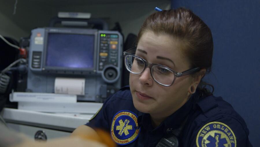 Holly listens to a patient