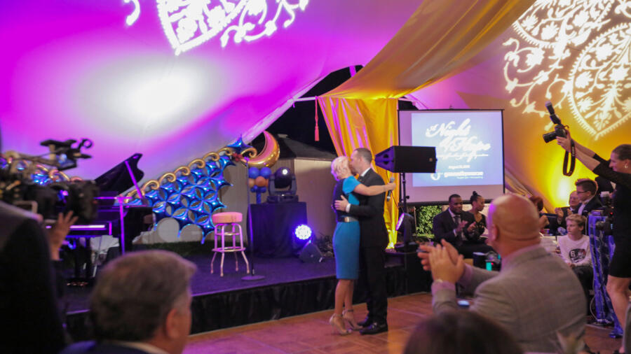 Donnie and Jenny embrace at the auction.