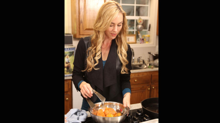 Jessica helps prepare the sweet potato pies. Kay says even though her daughters-in-law always ask her for the recipe, she won't give it out. How else would she get her sons to do anything for her?