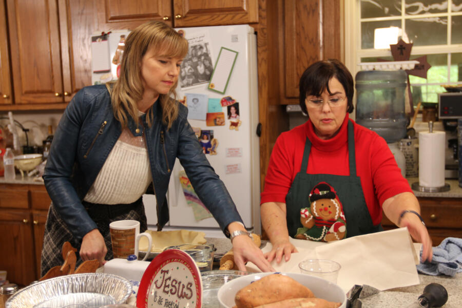 Missy helps her mother-in-law Kay prepare dinner for the family.