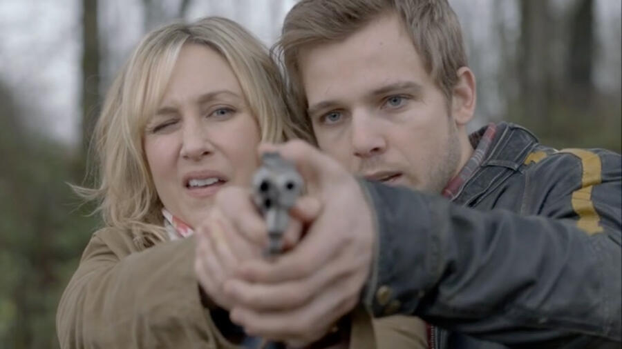 Dylan gives Norma shooting lesson