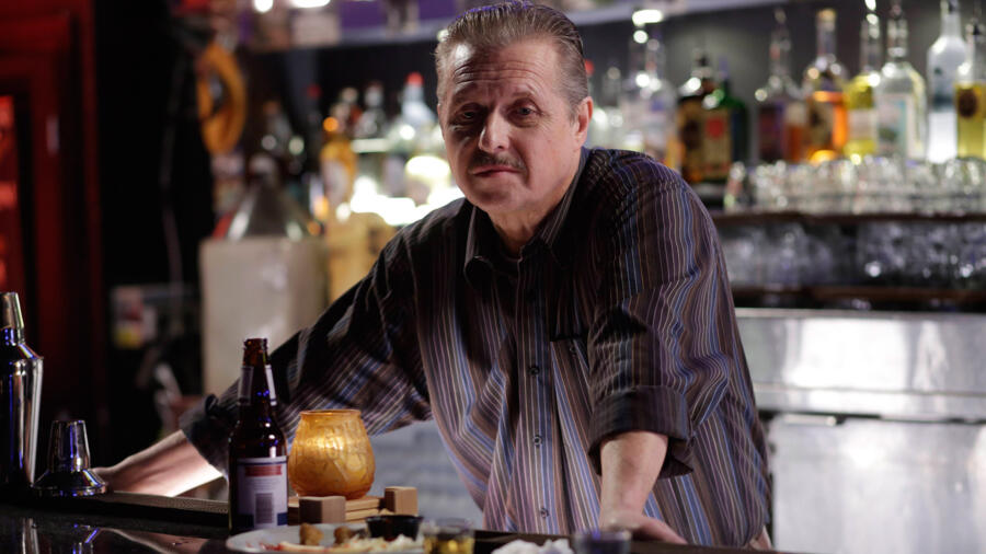 Bartender watches Dylan and Remo fight