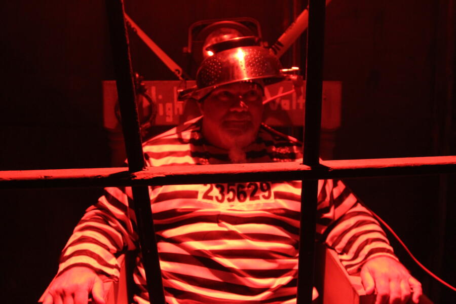 Godwin is dressed as a criminal about to get the electric chair. His last meal? A ham sammich, of course.