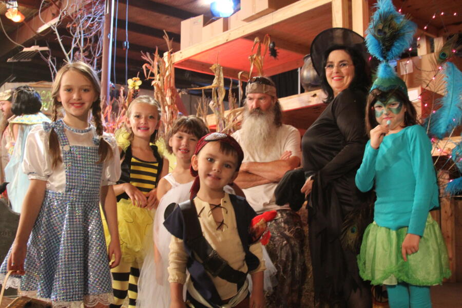 The Robertson children and Kay are all decked out in their Halloween best.
