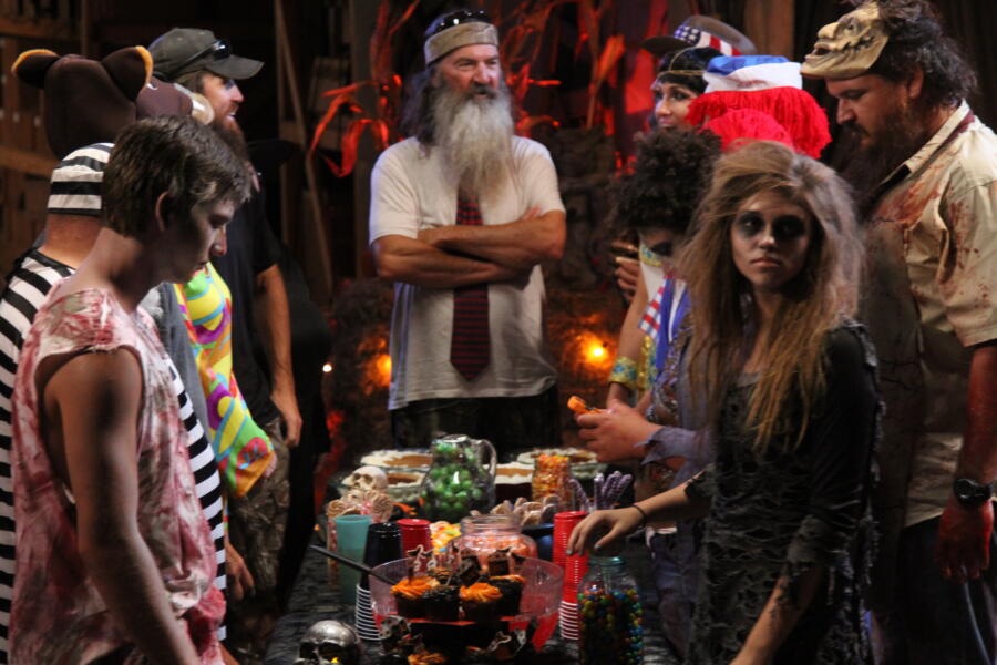 The Robertsons gather to share treats after a successful Halloween event.