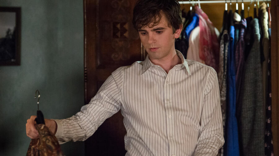 Norman returns from the bar and gets changed.