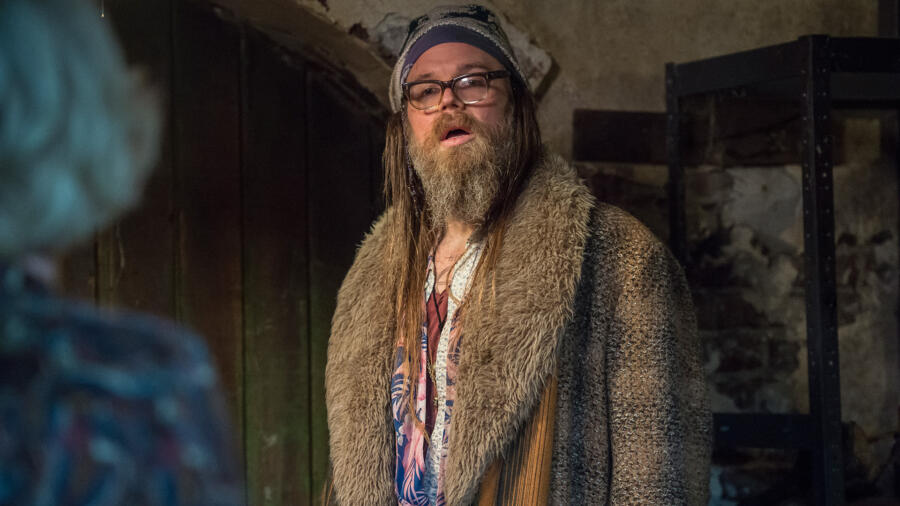 Chick watches in shock as Caleb is attacked by Norma/n.