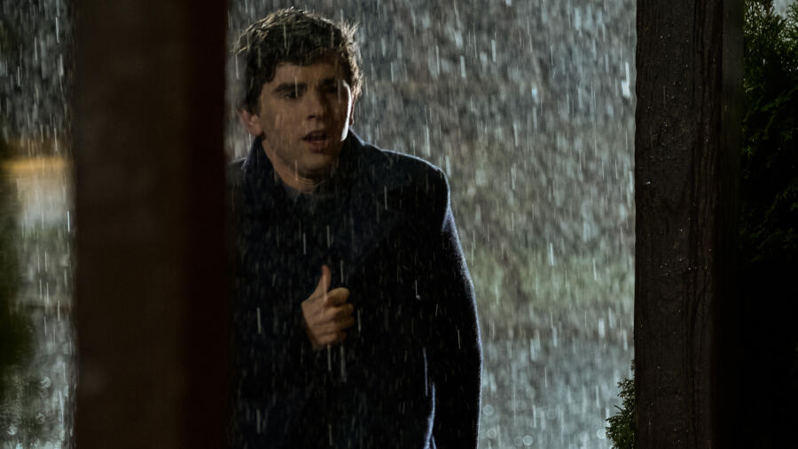 Norman (Freddie Highmore) rushes down to the office from the house to check Marion in.