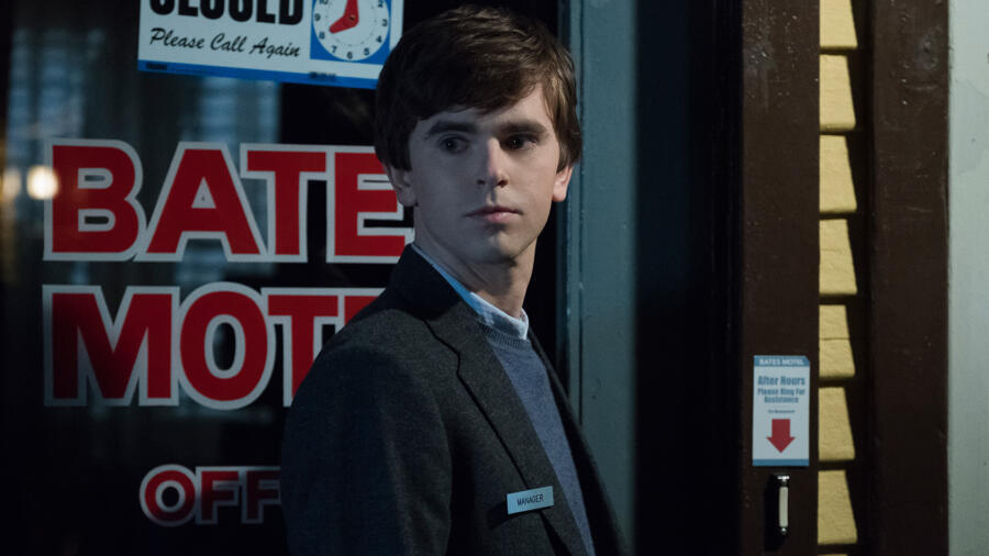 Norman (Freddie Highmore) is closing up when he receives a visitor.