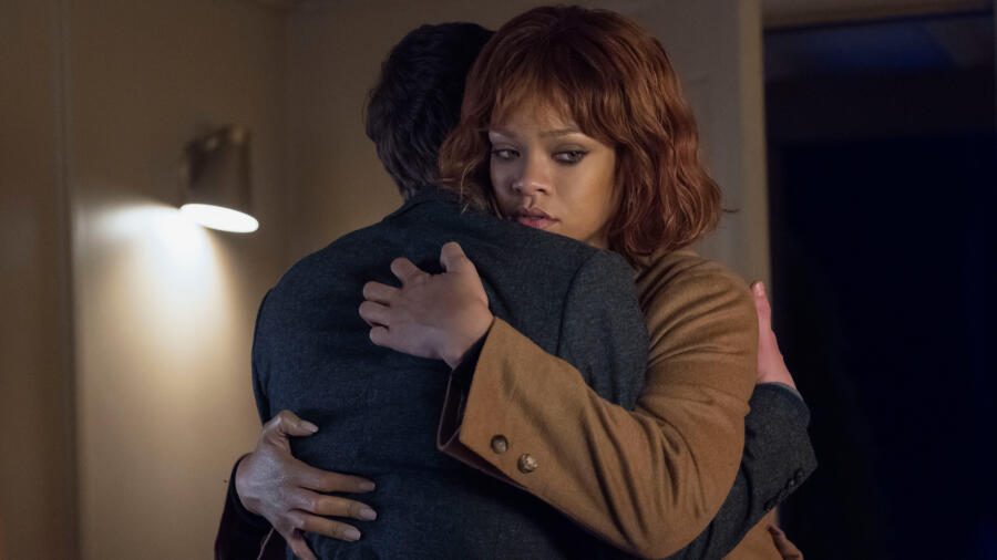 Marion gives Norman a final embrace.