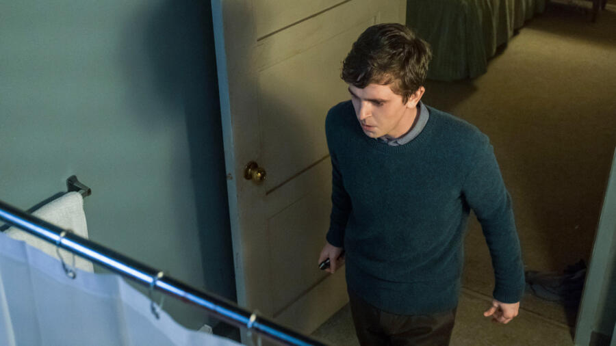 Norman enters the bathroom.