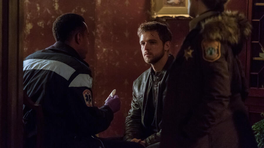 Dylan (Max Thieriot) sits patiently in the foyer