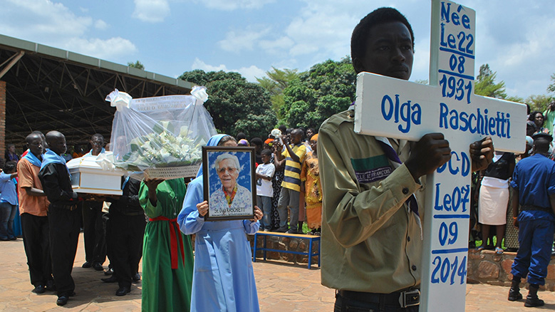 Hundreds of people attend the funeral ceremony of three Italian nuns, found dead inside a parish in a southern suburb of capital Bujumbura, at Sanctuaire Mont Sion Gikungu in Bujumbura, Burundi on September 10, 2014. (Photo by Ndabashinze Renovat/Anadolu Agency/Getty Images)
