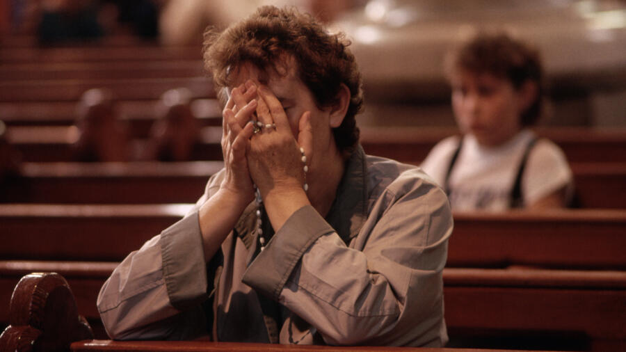 Women Prays in Church Photo by David Turnley/Corbis/VCG via Getty Images