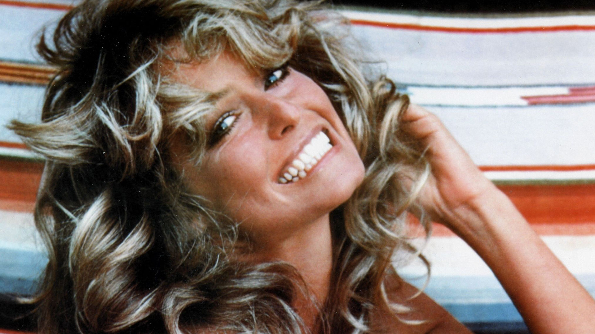 The Story Behind Farrah Fawcett's Iconic 1976 Swimsuit Poster