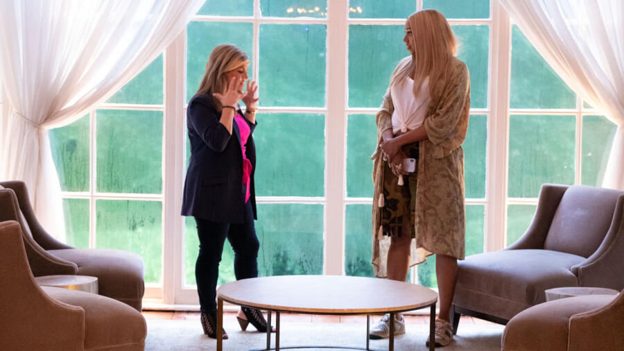 Kim listens to NeNe's story.