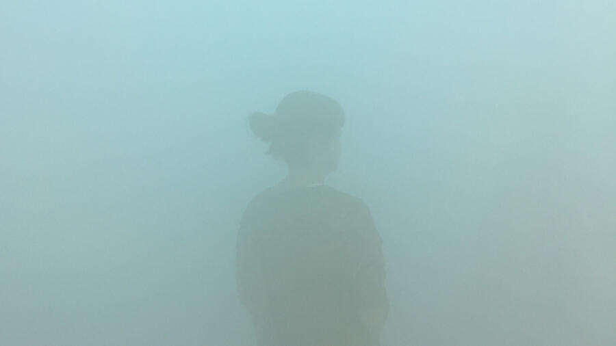 Woman in fog