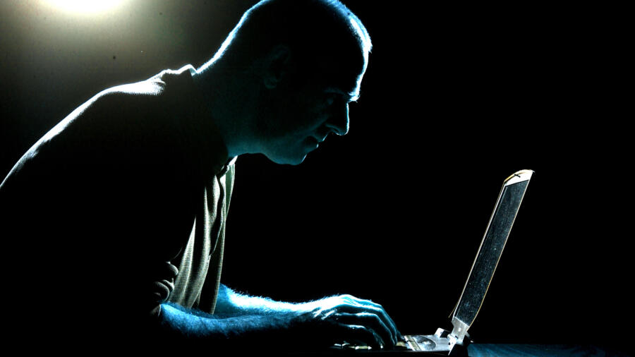 Conceptual photo of someone using the Internet to stalk someone