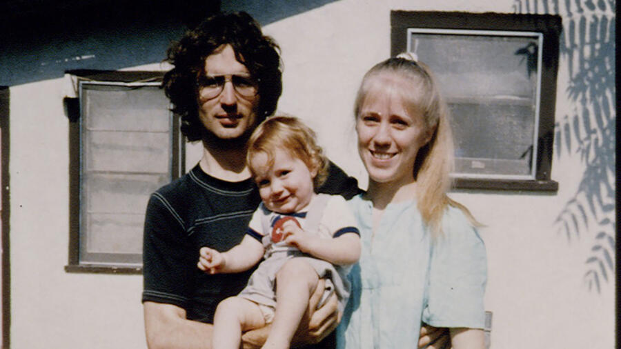 David Koresh, on left with son and wife