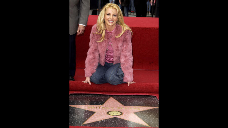 Britney Spears with her star on the Hollywood Walk of Fame