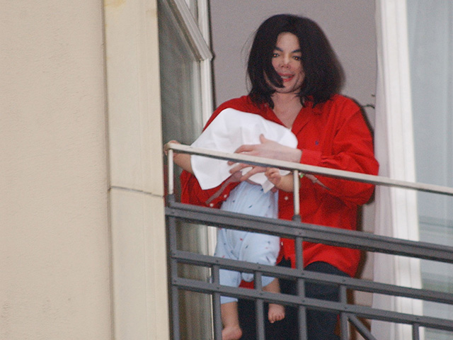 Michael Jackson dangling son Blanket over a balcony