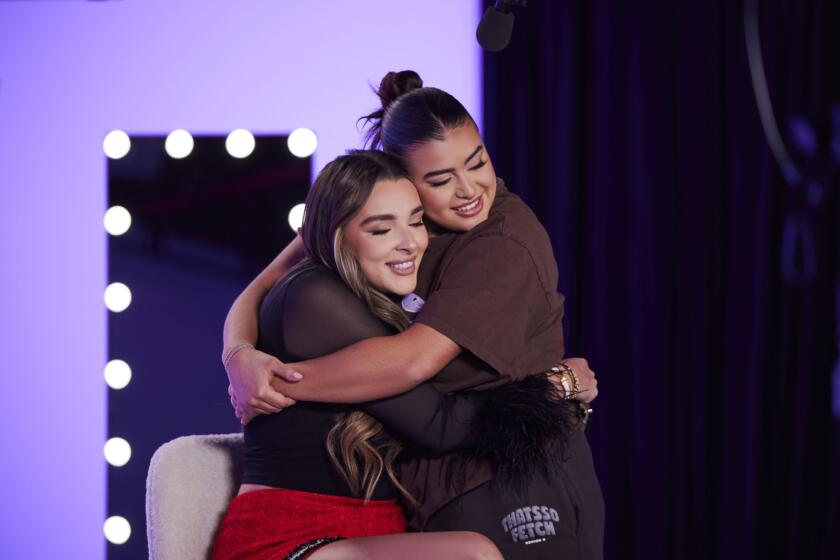 Kendall and Kalani hug behind the scenes of the Dance Moms Reunion.